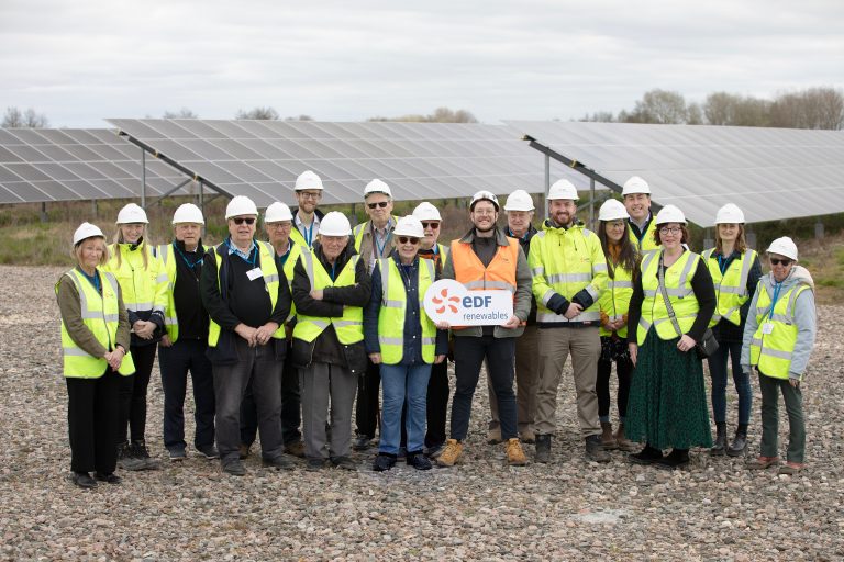 A group of people in high vis and hard hats at Sutton Bridge solar farm